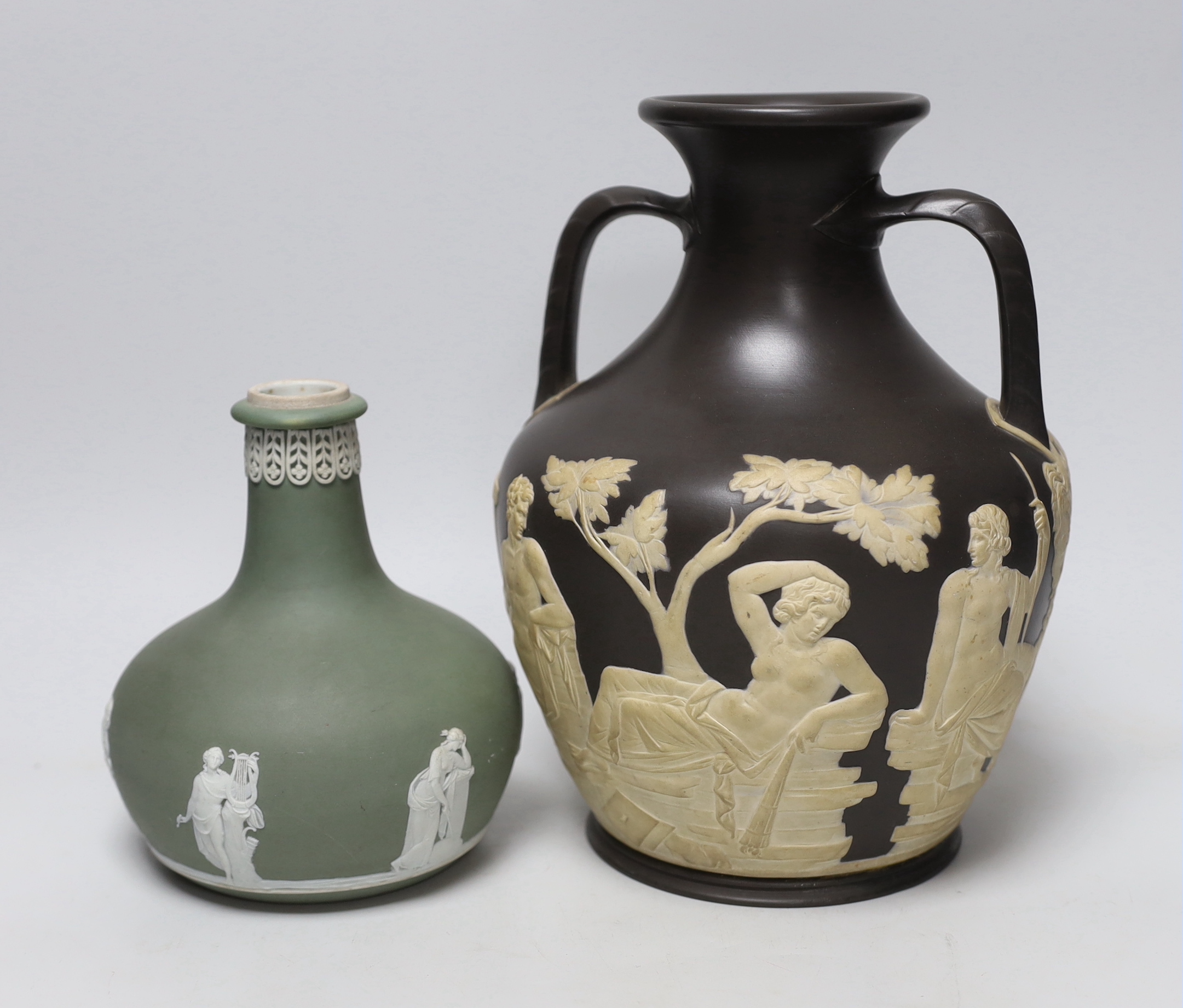 Attributed to Wedgwood, a jasper ware copy of the Portland vase, unmarked and a Wedgwood jasperware vase, tallest 25cm